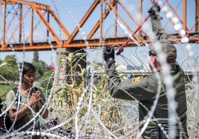 Razor wire fences line the US-Mexico border, but sometimes officers have to cut them apart