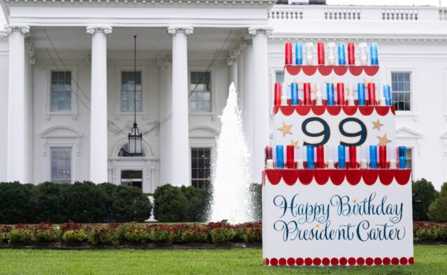 A sign wishing a happy birthday to former US president Jimmy Carter sits on the North Lawn
