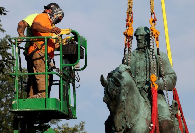 The statue of Confederate General Robert E. Lee being removed in Charlottesville, Virginia