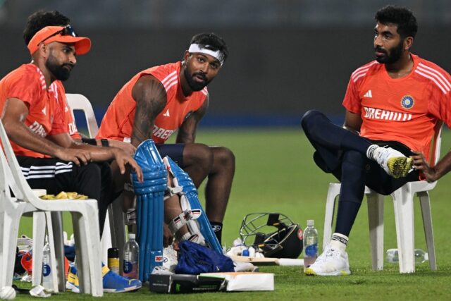 Let's talk: Jasprit Bumrah (right) chats with teammates Hardik Pandya (centre) and Mohamme