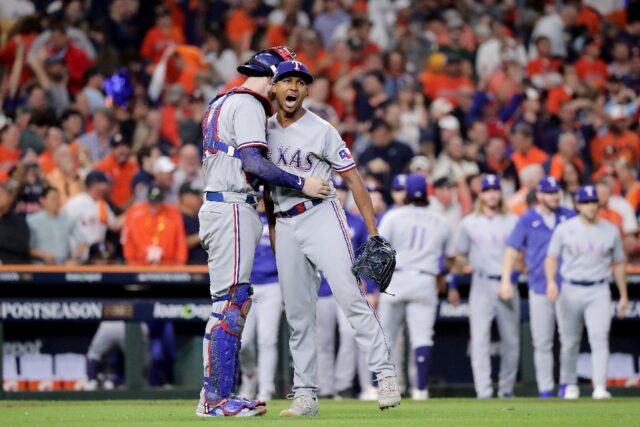 Texas Rangers players celebrate after sealing victory over the Houston Astros in the MLB p