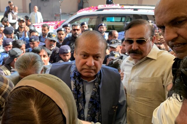 Three-time Pakistani prime minister and graft convict Nawaz Sharif (C) appeared in court T