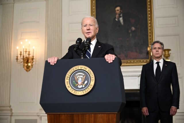US Secretary of State Antony Blinken looks on as President Joe Biden speaks about the Pale