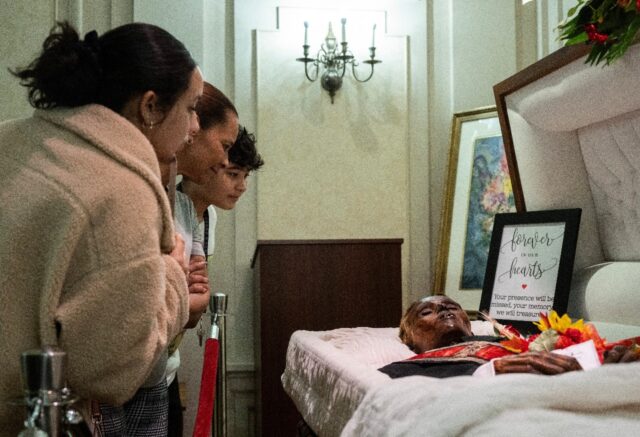 Visitors look at the body of 'Stoneman Willie,' a thief who died in a Pennsylvania prison