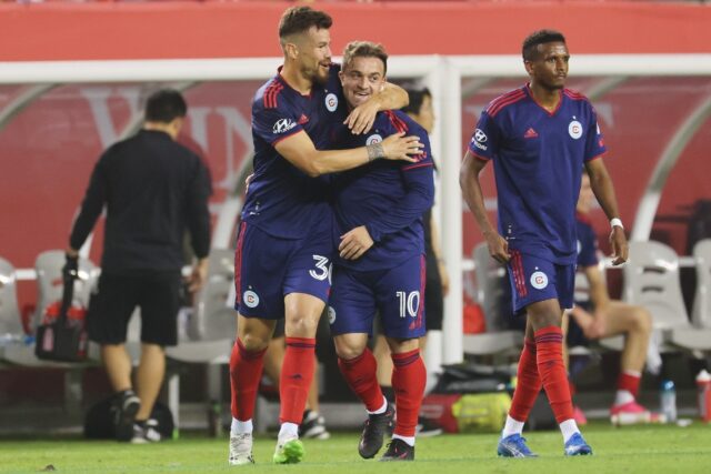 Xherdan Shaqiri #10 of Chicago Fire FC celebrates with Gastón Giménez #30 after scoring