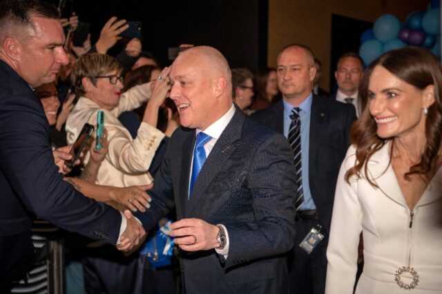 New Zealand's incoming prime minister Christopher Luxon celebrating his general election s