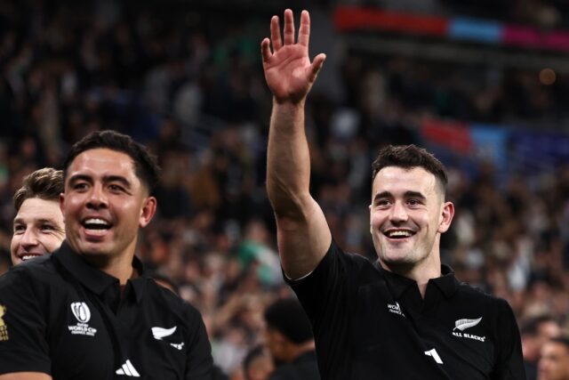 New Zealand players celebrate their quarter-final win over Ireland in Paris at the Rugby W