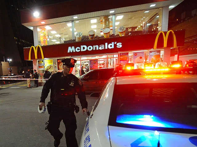 Crime scene tape surrounds a Manhattan west side McDonalds after an incident, Friday, March 25, 2011, in New York. (AP Photo/Louis Lanzano)