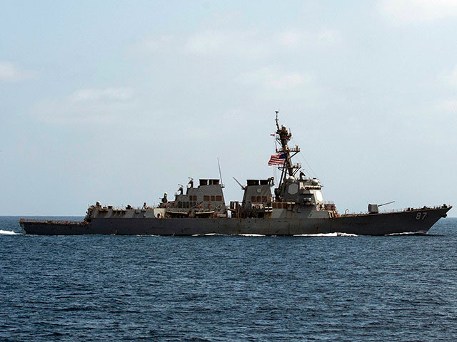 In this image released by the U.S. Navy, the USS Mason (DDG 87), conducts maneuvers as par