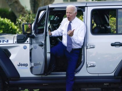 President Joe Biden talks as he gets into Jeep Wrangler 4xe Rubicon on the South Lawn of t