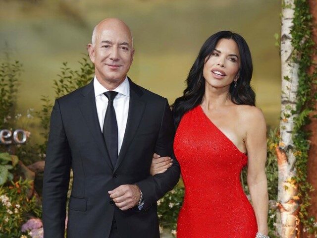 Jeff Bezos, left, and Lauren Sanchez pose for photographers upon their arrival for the wor
