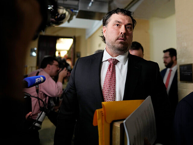 Rep.-elect Morgan Luttrell, R-Texas, walks past reporters during the opening day of the 11