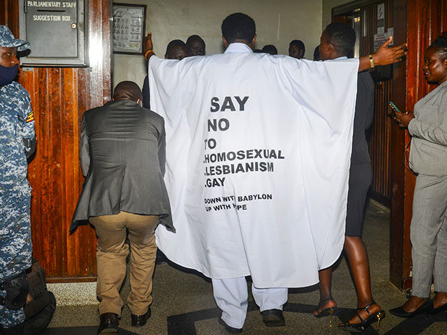Ugandan MP John Musila wears clothes with an anti-LGBTQ message as he enters the Parliamen