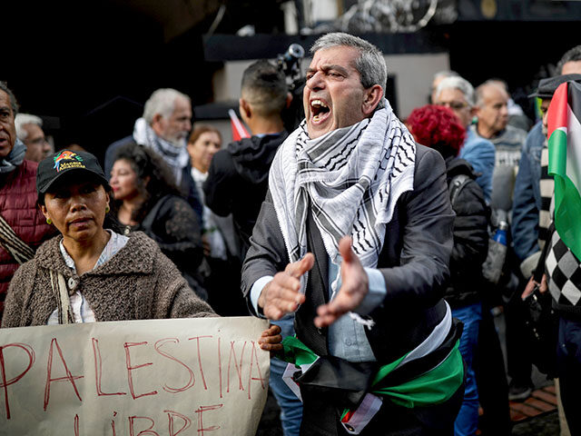 People attend a vigil coined "Palestine Lives," to show support for the Palestin