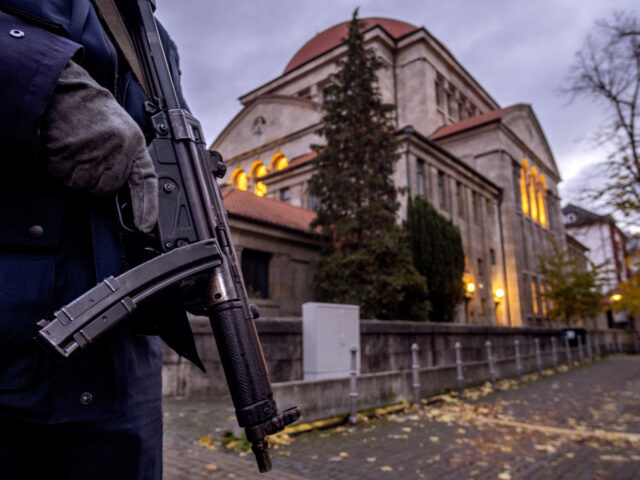 FILE -A German police officer stands guard in front of the synagogue in Frankfurt, Germany
