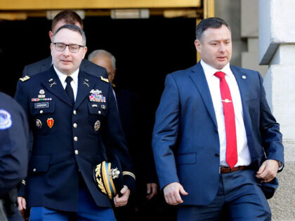 FILE - In this Nov. 19, 2019, file photo National Security Council aide Lt. Col. Alexander Vindman, left, walks with his twin brother, Army Lt. Col. Yevgeny Vindman, after testifying before the House Intelligence Committee on Capitol Hill in Washington during a public impeachment hearing of President Donald Trump's efforts …