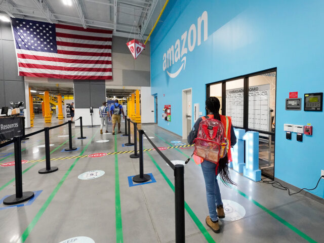 An oversized American flag greets employees as they enter the Amazon Robotic Sorting Fulfi
