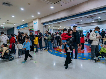 CHONGQING, CHINA - NOVEMBER 23, 2023 - Parents with children suffering from respiratory diseases line up at a children's hospital in Chongqing, China, November 23, 2023. (Photo credit should read CFOTO/Future Publishing via Getty Images)