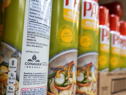 FILE - Cooking spray oils by Pam, a Conagra brand, rest on a supermarket shelf, June 25, 2