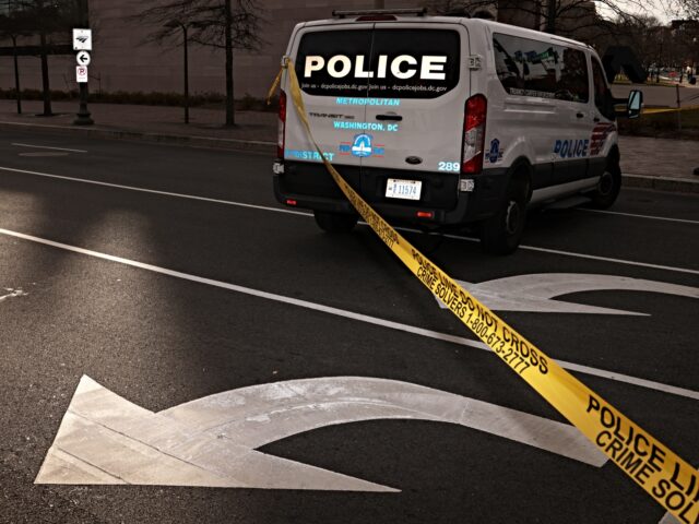 WASHINGTON, DC - DECEMBER 07: Police tape is set up during a protest to block traffic at P