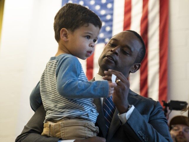 Republican Candidate for Governor, Attorney General Daniel Cameron, holds his son after ca