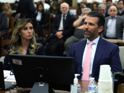 Donald Trump Jr. and lawyer Alina Habba sit in the courtroom for the fraud trial of the Tr