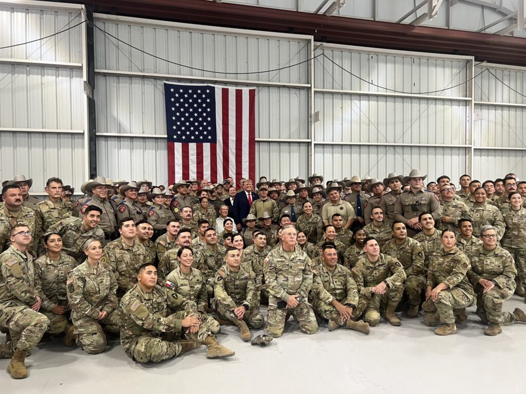 Former President Trump and Governor Greg Abbott with Texas Border Security Forces. (Texas Department of Public Safety)