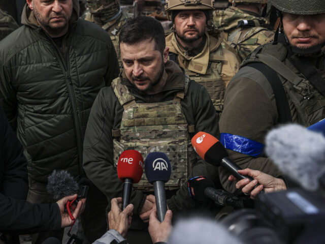 BUCHA, KYIV PROVINCE, UKRAINE, APRIL 04: Ukrainian President Volodymyr Zelenskyy accompanied by Ukrainian soldiers speaks to press during his visit at the town of Bucha, after it was liberated from Russian Army, in Bucha, Ukraine on April 04, 2022. (Photo by Metin AktaÅ/Anadolu Agency via Getty Images)