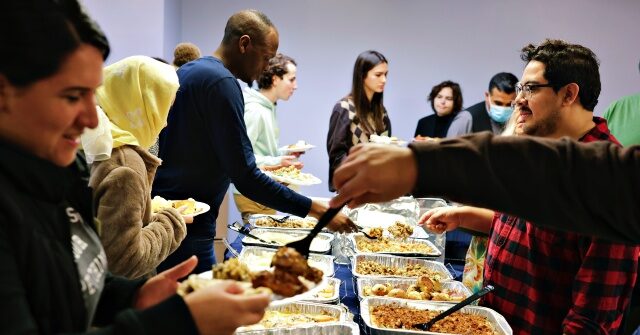 Migrants Across America Enjoy First Thanksgiving with Free Turkey Feasts