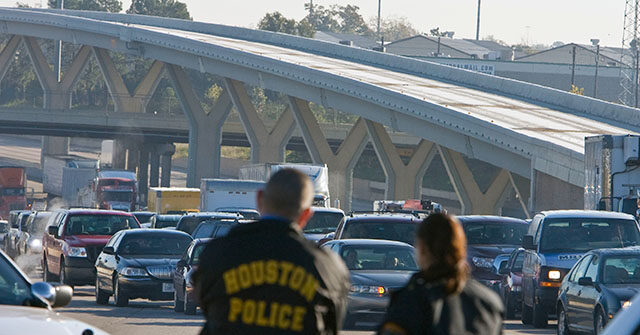 WATCH: Good Samaritan Drags Officer to Safety During Shootout