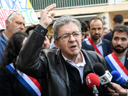 Former leader of the leftist "La France Insoumise" (LFI) party Jean-Luc Melenchon talks to journalists before a march in support of former Mayor of Saint-Brevin Yannick Morez, who resigned after being targeted over plans concerning an asylum-seekers' centre, in Saint-Brevin-les-Pins, western France, on May 24, 2023. Some 2000 people took …