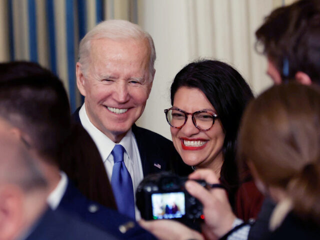 U.S. President Joe Biden (L) poses for photographs with Rep. Rashida Tlaib (D-MI) during t