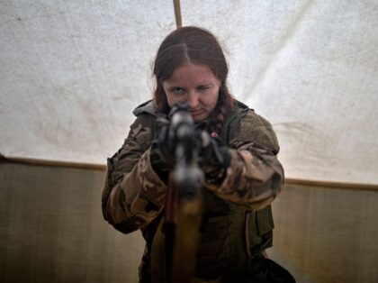 KYIV, UKRAINE - JULY 24: Ukrainian civilians, mostly women, attend a military training to