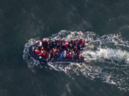 TOPSHOT - This aerial picture taken on September 16, 2023, from a police aircraft belonging to the French Police Aux Frontieres (PAF) shows migrants onboard of a dinghy used for smuggling as they attempt to cross the English Channel to Britain from a beach at Le Touquet, northern France. (Photo …
