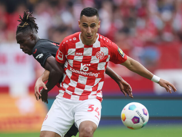 MAINZ, GERMANY - SEPTEMBER 30: Anwar El Ghazi of Mainz is challenged by Odilon Kossounou o