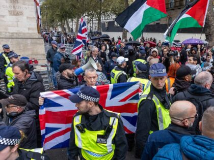 Activists from right-wing Turning Point UK hold a counter-protest to the National March fo