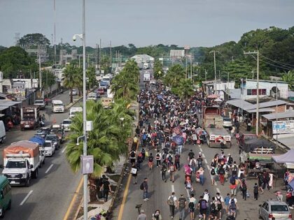 Migrants travel through Tapachula, Chipas state, Mexico, on Monday, Oct. 30, 2023. Mexican President Andres Manuel Lopez Obrador will take a proposal to reduce the flow of migrants up north for discussion with US counterpart Joe Biden after agreeing on a common strategy with other Latin American nations. Photographer: Mahe …