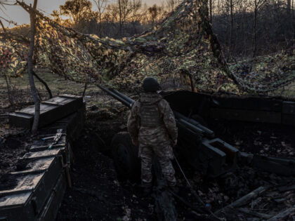 DONETSK OBLAST, UKRAINE - NOVEMBER 01: A Ukrainian soldier works at their artillery positi