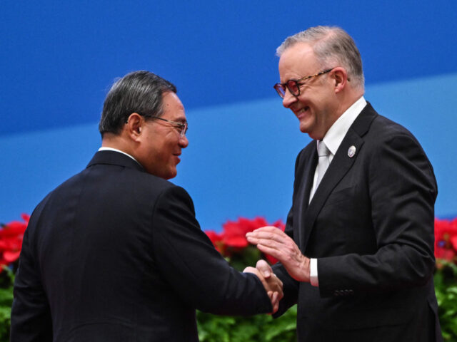 China's Premier Li Qiang (L) and Australia's Prime Minister Anthony Albanese shake hands d