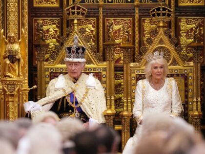 LONDON, ENGLAND - NOVEMBER 7: King Charles III sits besides Queen Camilla during the State