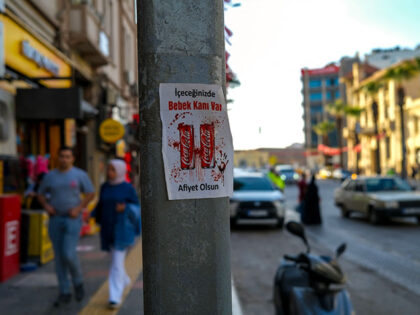 11/07/2023 Izmir, Turkey. Stickers reading 'Baby blood in your drink!' are being used to protest against Coca Cola. in Turkiye, people would boycott all american and israeli brand as a solidarity with palestinian . (Photo by Murat Kocabas / Middle East Images / Middle East Images via AFP) (Photo by …