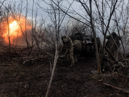 DONETSK OBLAST, UKRAINE - 18 NOVEMBER: Ukrainian soldiers fire artillery at their fighting