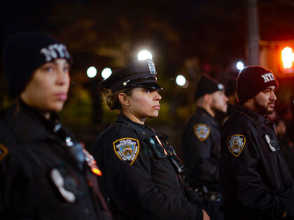 NYPD officers stand guars as demonstrators in support of Palestinians hold a rally to call for a ceasefire, in the Brooklyn borough of New York City on November 18, 2023. Israel has vowed to destroy Hamas in response to the October 7 attacks which Israeli officials say killed about 1,200 …