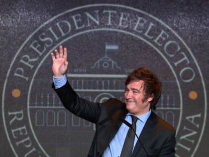 Argentine presidential candidate for the La Libertad Avanza alliance Javier Milei waves to supporters after winning the presidential election runoff at his party headquarters in Buenos Aires on November 19, 2023. Libertarian outsider Javier Milei pulled off a massive upset Sunday with a resounding win in Argentina's presidential election, a …