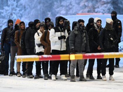 Migrants arrive at the international border crossing at Salla, northern Finland, on Novemb