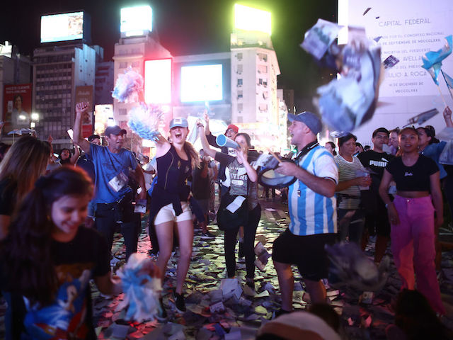 BUENOS AIRES, ARGENTINA - NOVEMBER 19: Supporters of newly elected Argentine President Javier Miley of La Libertad Avanza celebrate after polls close in the presidential runoff on November 19, 2023 in Buenos Aires, Argentina.  According to the official results, Javier Miley from La Libertad Avanza received 55.69% of the votes, and Sergio Massa from Union Por la Patria received 44.30% after 99.25 votes were counted.  The presidential election runoff to succeed Alberto Fernandez comes at a time when Argentines have been hit hard by an annual inflation rate of 142.7%.  (Photo by Thomas Cuesta/Getty Images)