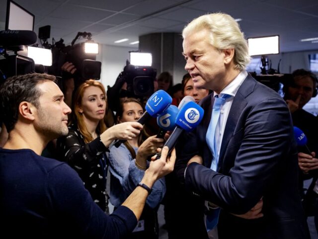 Leader of the Party for Freedom (PVV) Geert Wilders (R) speaks to the press about the imme