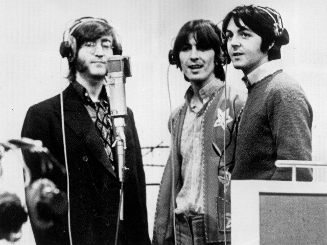 1968: Three Beatles; from left to right John Lennon (1940 - 1980), George Harrison (1943 - 2001) and Paul McCartney, record voices in a studio for their new cartoon film 'Yellow Submarine'. (Photo by Keystone Features/Getty Images)