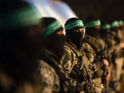 TOPSHOT - Palestinian members of the Ezzedine al-Qassam Brigades, the armed wing of the Ha
