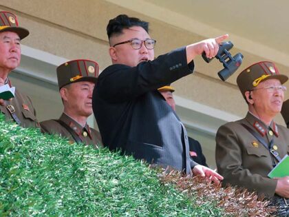 This undated picture released from North Korea's official Korean Central News Agency (KCNA) on April 14, 2017 shows North Korean leader Kim Jong-Un (C) inspecting the "Dropping and Target-striking Contest of KPA Special Operation Forces - 2017" at an undisclosed location in North Korea. North Korean leader Kim Jong-Un has …